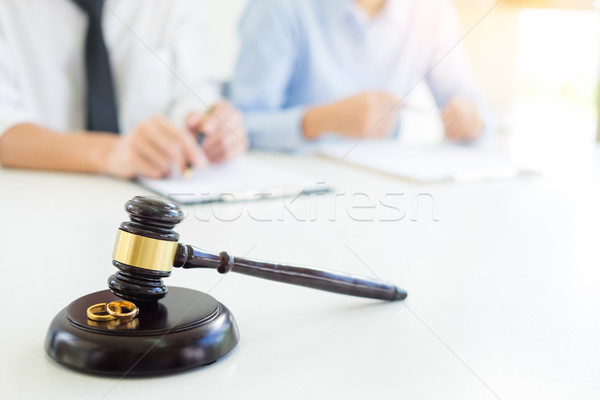 Angry couple arguing telling their problems to Judge gavel decid Stock photo © snowing