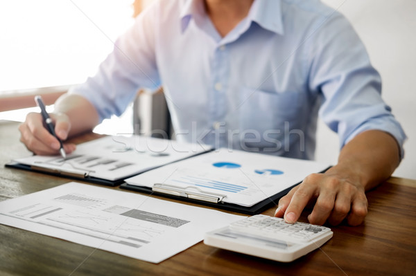 business men working on wooden desk(table) with notebook compute Stock photo © snowing