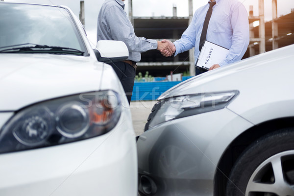 Customer shake hand with auto insurance agents after agreeing to Stock photo © snowing