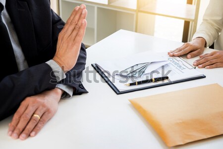 Man signing a car insurance policy, the agent is holding the doc Stock photo © snowing