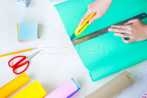 Woman's hand cut paper Making a scrap booking or other festive d Stock photo © snowing