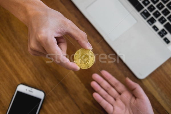 hand exchange golden metal Bitcoin crypto currency investment- s Stock photo © snowing