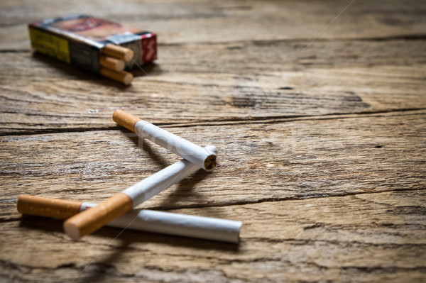 Tobacco in the cigarette, lying on a wooden table. Stock photo © snowing