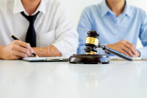 Angry couple arguing telling their problems to Judge gavel decid Stock photo © snowing