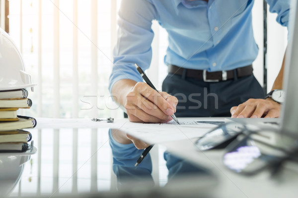 Person's engineer Hand Drawing Plan On Blue Print with architect Stock photo © snowing