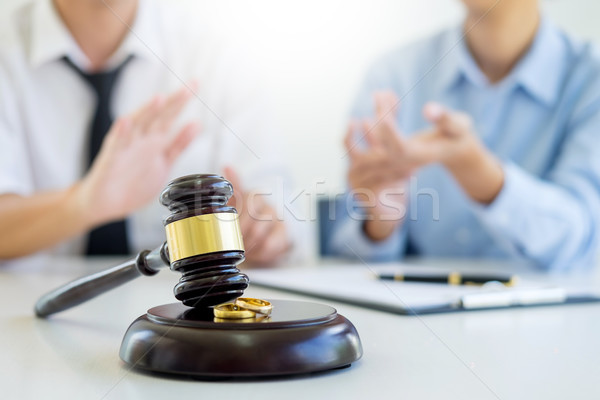 Angry couple arguing telling their problems to Judge gavel decid Stock photo © snowing