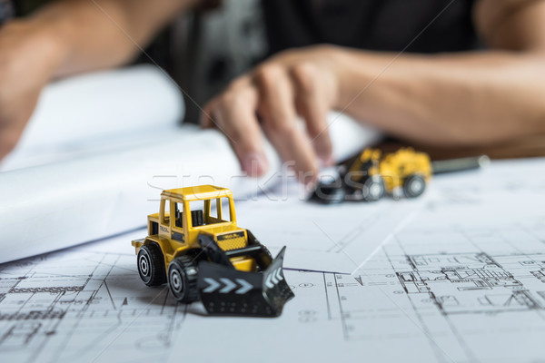 Creative architect projecting on the big drawings in the dark lo Stock photo © snowing