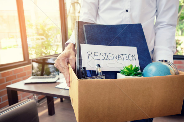 Businessman resignation packing up all his personal belongings a Stock photo © snowing