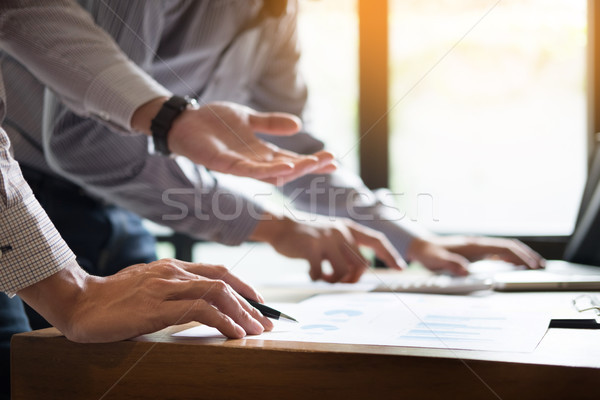 business partners discussing documents and ideas plans to his co Stock photo © snowing