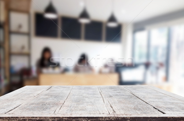 Selected focus empty brown wooden table and Coffee shop blur bac Stock photo © snowing