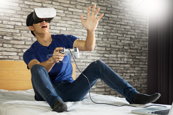 The VR headset design is generic and no logos, Man wearing virtu Stock photo © snowing