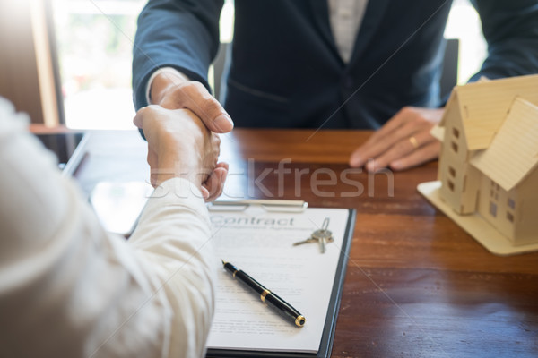 House developers agent or financial advisor and customers shakin Stock photo © snowing