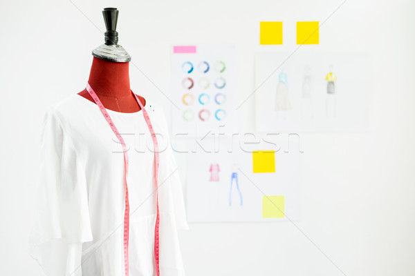 garment design on mannequin Red dummy with measuring tape in tai Stock photo © snowing