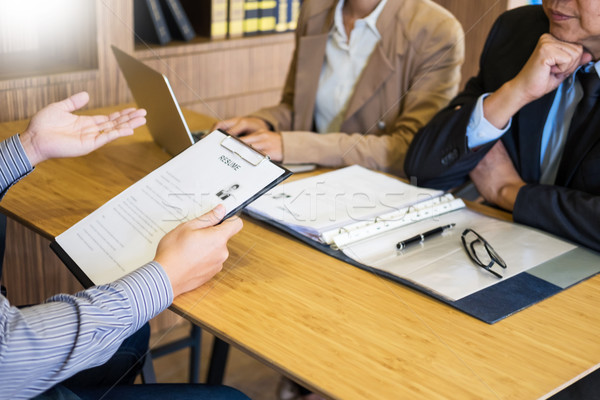 young man explaining about his profile to business managers sitt Stock photo © snowing