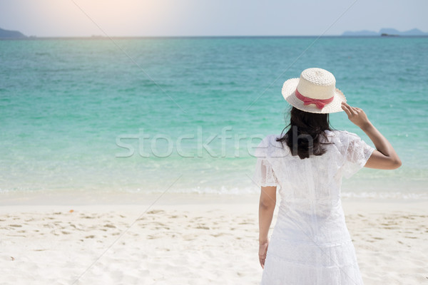 a beautiful carefree Woman relaxing at the beach enjoying her su Stock photo © snowing