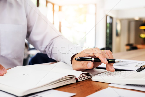 Accountant or banker calculating balance. finances investment ec Stock photo © snowing