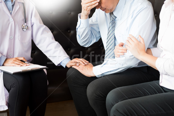 medical doctor holing senior patient's hands for encouragement c Stock photo © snowing