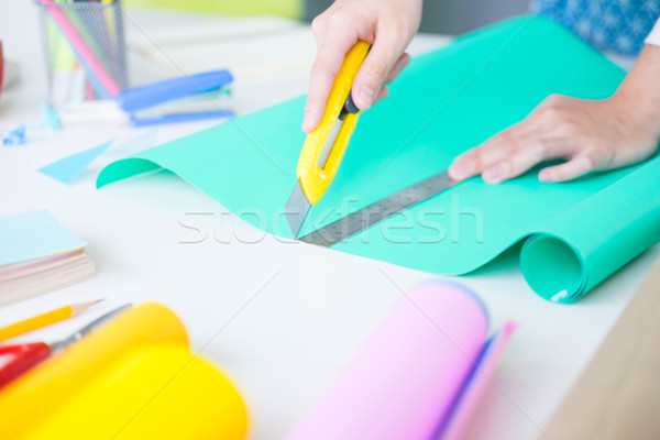 Woman's hand cut paper Making a scrap booking or other festive d Stock photo © snowing