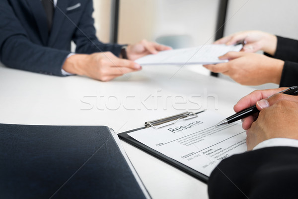 Hands of man giving application portfolio to HR man in office fo Stock photo © snowing