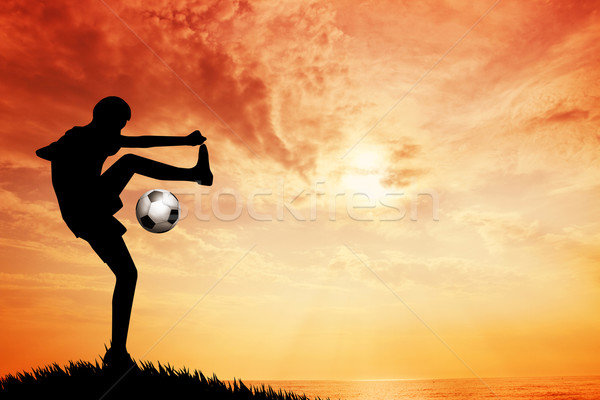 Footballer at sunset Stock photo © sognolucido