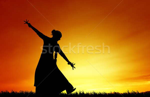 Woman dancing indian dance at sunset Stock photo © sognolucido