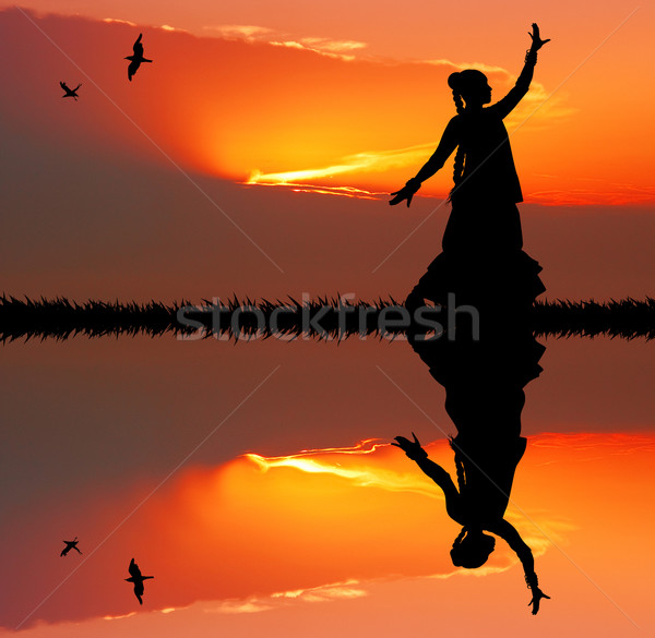 Woman dancing indian dance at sunset Stock photo © sognolucido