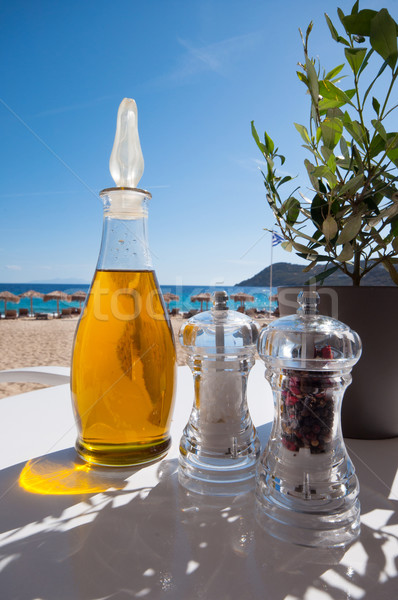 olive oil, salt and pepper on the beach Stock photo © sognolucido