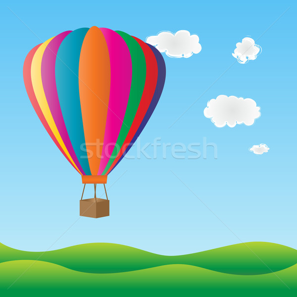 Coloré ballon à air chaud battant vert collines ciel [[stock_photo]] © soleilc