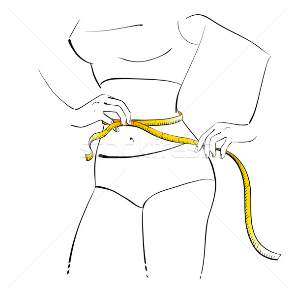 Stock photo: Girl measuring her waist. 