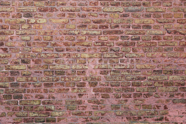 Pared de ladrillo edad capeado pared fondo naranja Foto stock © sophie_mcaulay