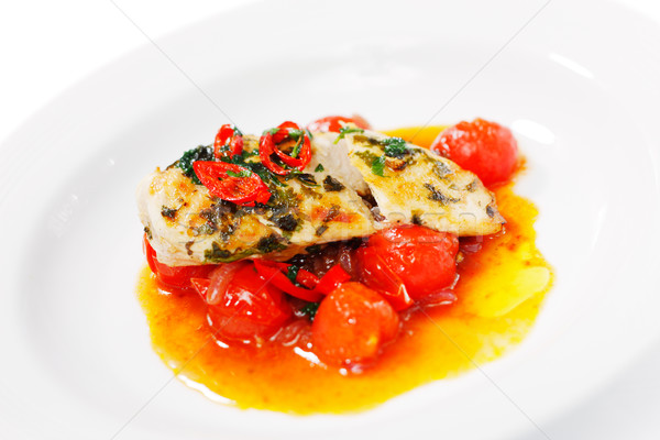Grilled chili chicken on a bed of roasted cherry tomatoes Stock photo © SophieJames