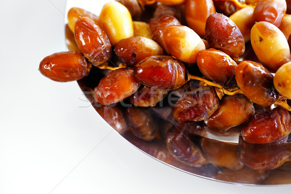 Dried Arabic dates presented on an ornate tra Stock photo © SophieJames