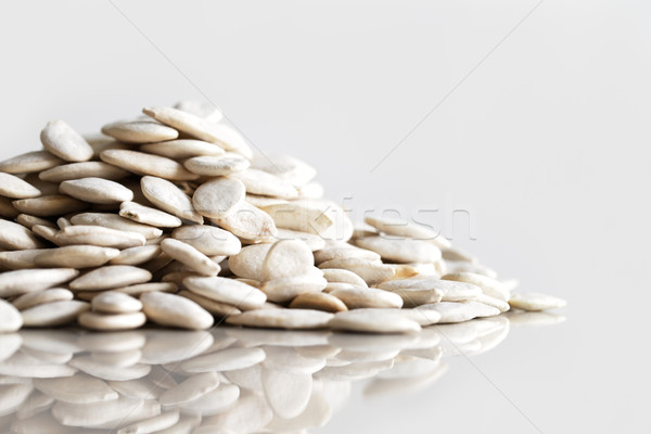 A heap of dried pumpkin seeds Stock photo © SophieJames
