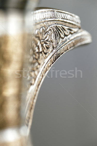 An ornate dallah which is a metal pot for making Arabic coffee Stock photo © SophieJames