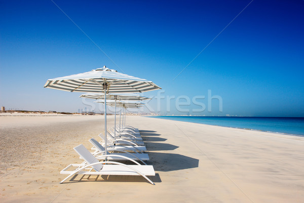 Reclining deck chairs on the beach Stock photo © SophieJames