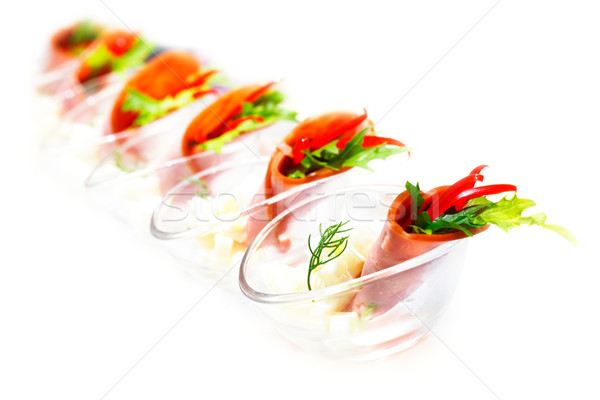 Tasty appetizer capsicum and rocket salad wrapped in turkey ham Stock photo © SophieJames