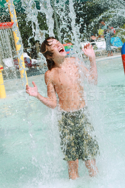 Boy playing in water at a waterpark Stock photo © soupstock