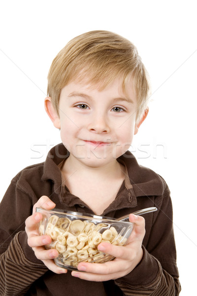 Young  boy holding a bowl of cereal Stock photo © soupstock