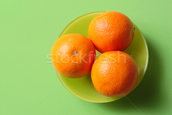 Sinaasappelen groene kom drie natuur vruchten Stockfoto © soupstock