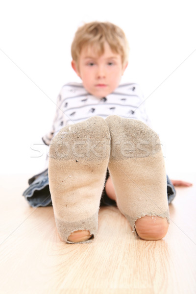Boy wearing dirty socks with holes in them Stock photo © soupstock