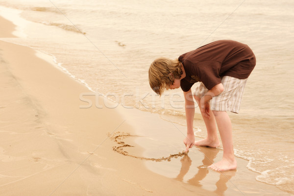 Iscritto sabbia disegno spiaggia acqua Foto d'archivio © soupstock