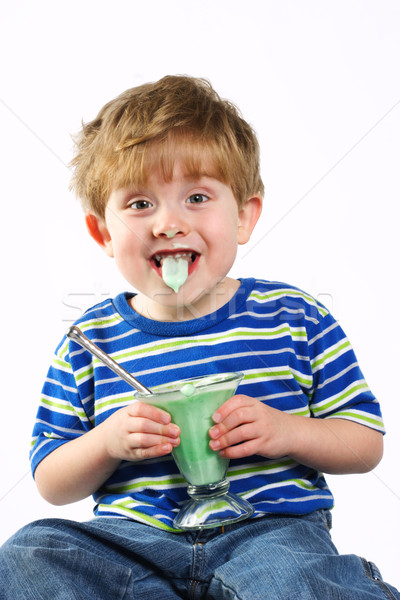 Messy young boy eating frozen dessert Stock photo © soupstock