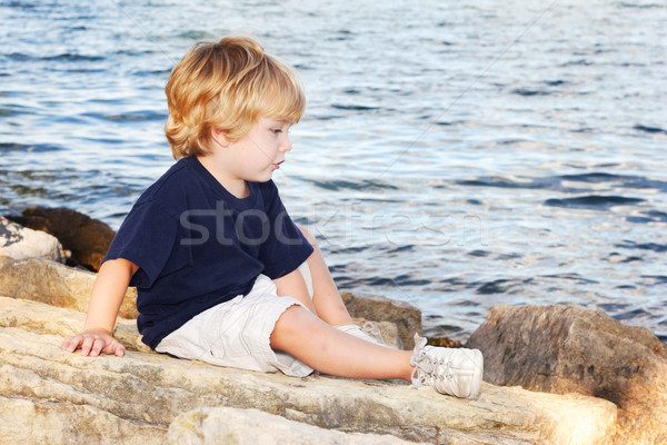 Oturma kenar göl çocuk erkek Stok fotoğraf © soupstock