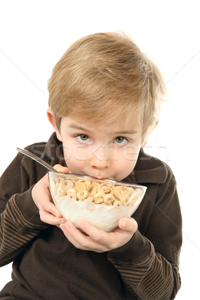 Young  boy holding a bowl of cereal Stock photo © soupstock