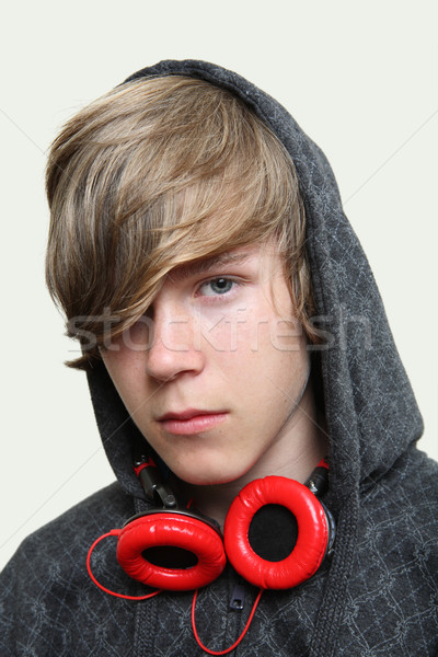 Serious Teenage  Boy wearing headphones Stock photo © soupstock