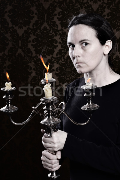Old Hag holding a dusty and tarnished candleabra Stock photo © soupstock