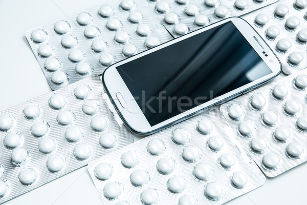 Orvosi okostelefon modern mobiltelefon tabletták üzlet Stock fotó © Spectral