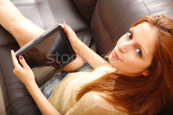 Kız genç kadın rahatlatıcı kanepe Stok fotoğraf © Spectral