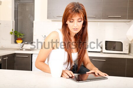 Stock photo: Chatty in the kitchen	