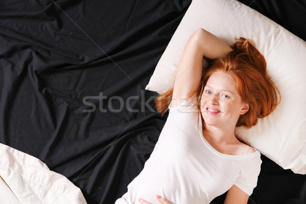 A young woman in bed Stock photo © Spectral